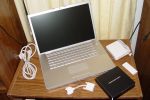 MacBook Pro With Accessories - MacBook Pro, AC extension, power brick, DVI -> VGA adapter, remote and installation CDs + manuals.